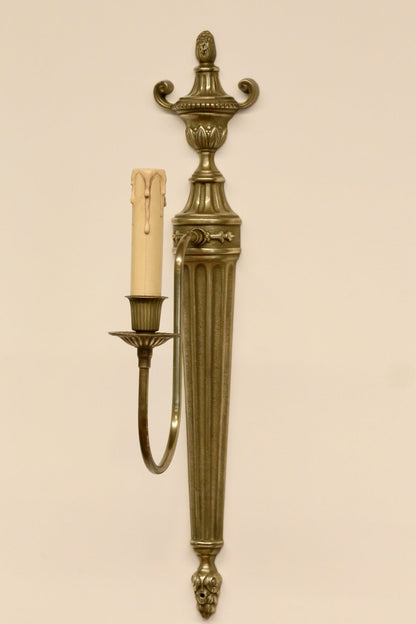 French neoclassical brass wall sconce, three-quarter view