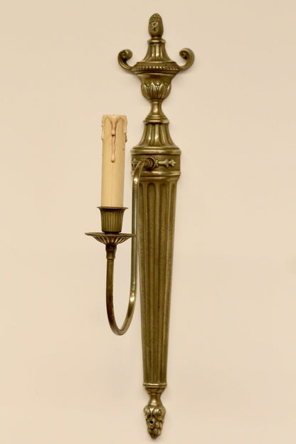 French neoclassical brass wall sconce, front view on the wall