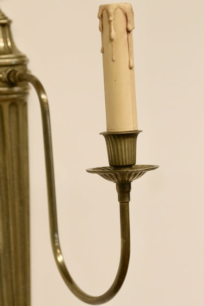 Close-up of candle sleeve and drip pan, French brass sconce