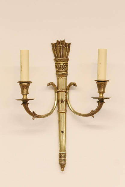 French Empire double wall sconce in ornate brass with quiver of arrows crest, swan neck arms and candle sleeves