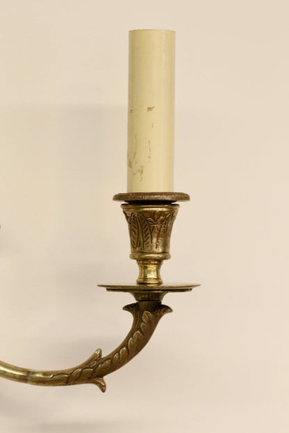 Close-up of brass candle cup, drip pan and swan neck arm