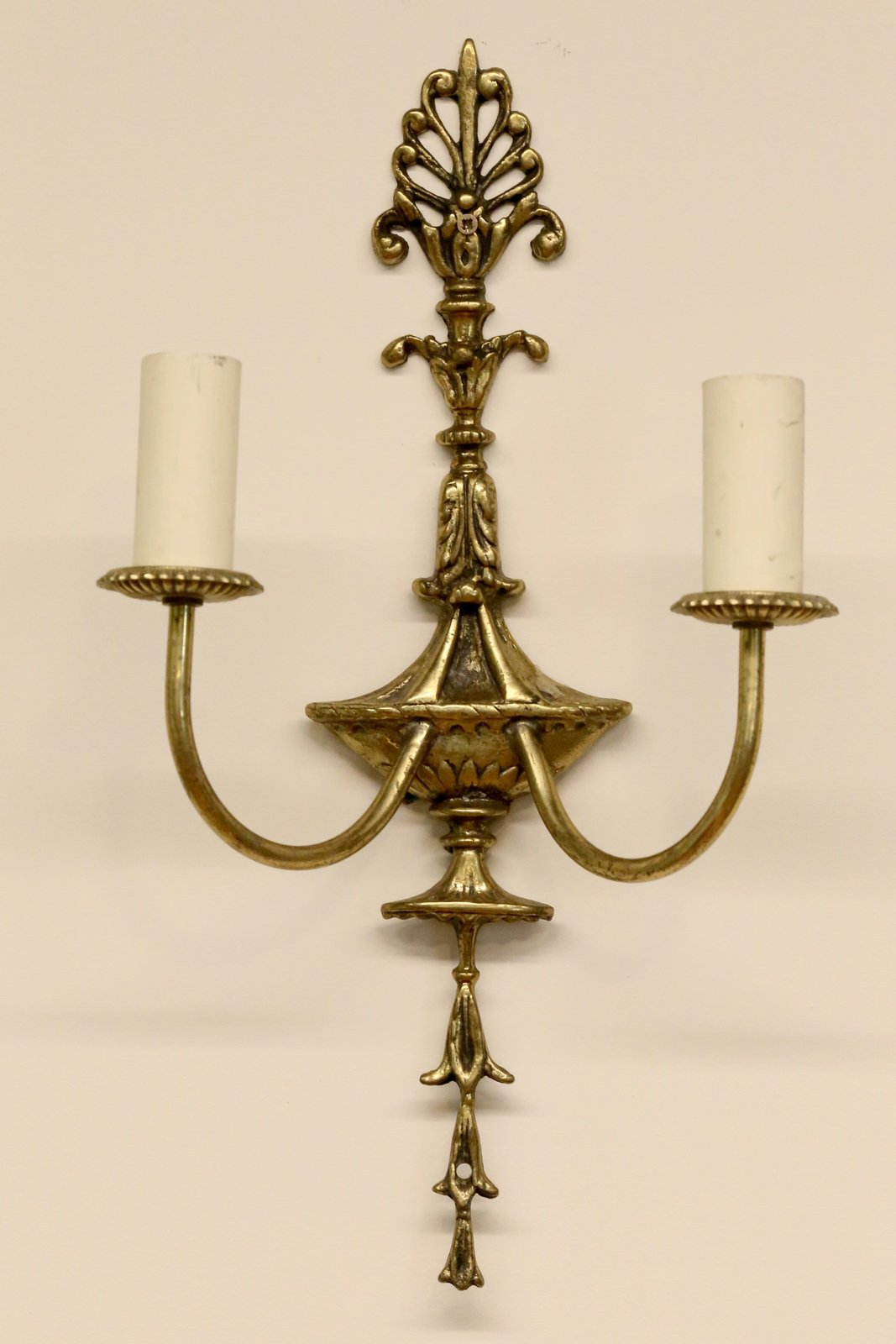 French Empire gilt brass double sconce with anthemion crest, urn body, scrolled arms and drop finial, H65cm