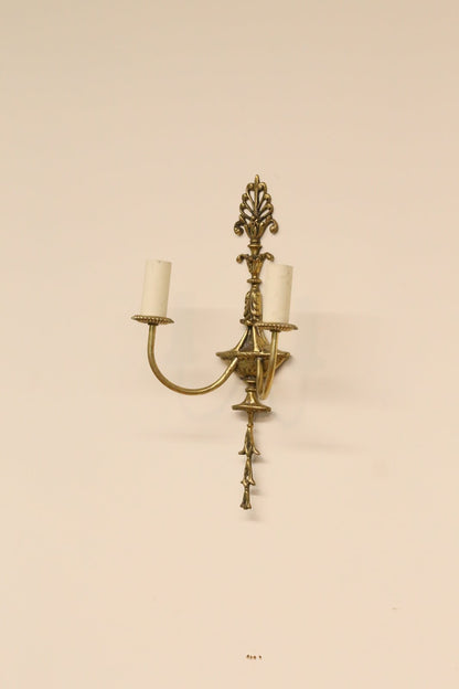 French Empire gilt brass double sconce on the wall, full view