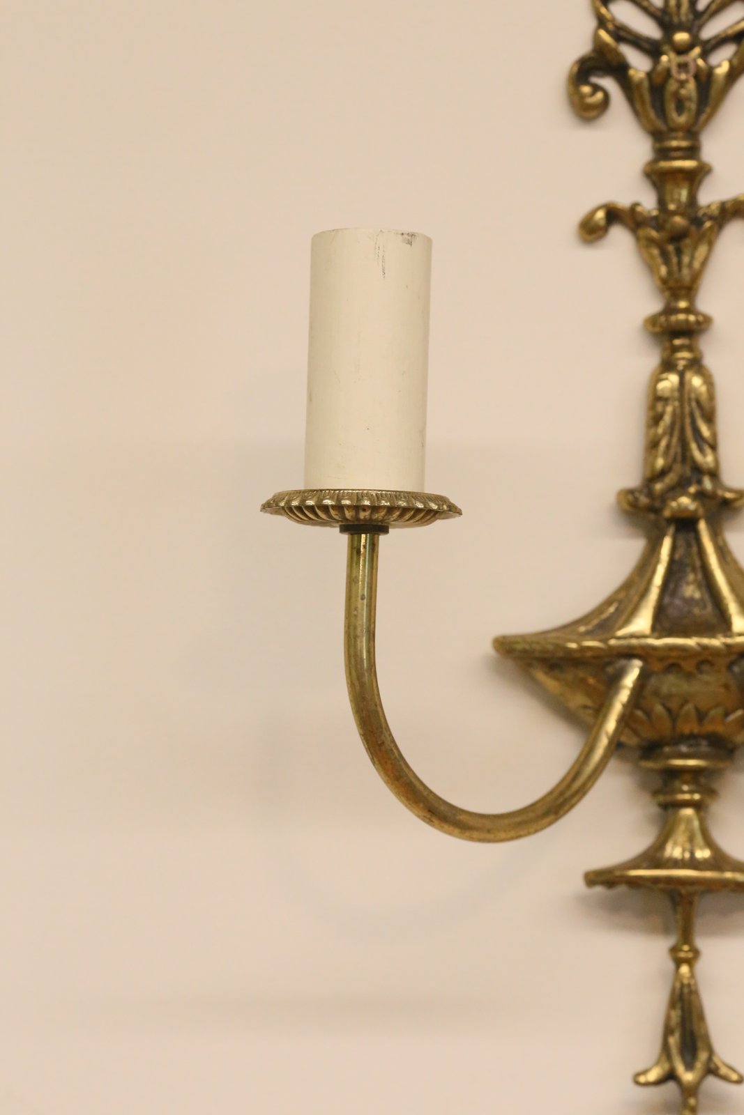 Close-up of brass arm, urn body and candle sleeve