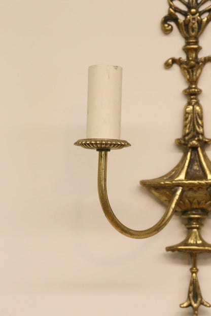 Close-up of brass arm, urn body and candle sleeve