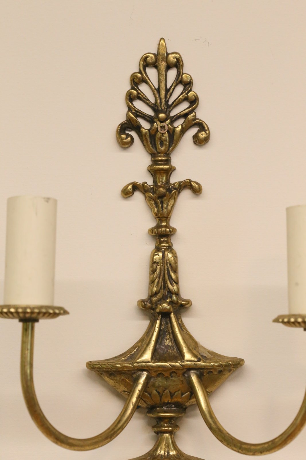 Close-up of anthemion crest on the French Empire gilt sconce