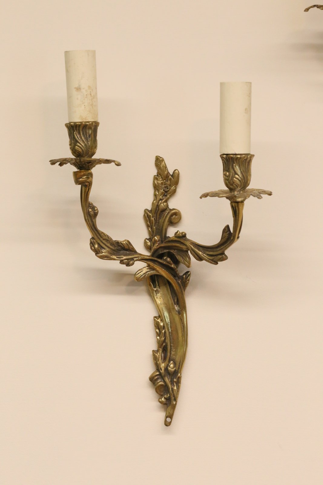 French Louis XV style gilt brass two-arm wall sconce, front view