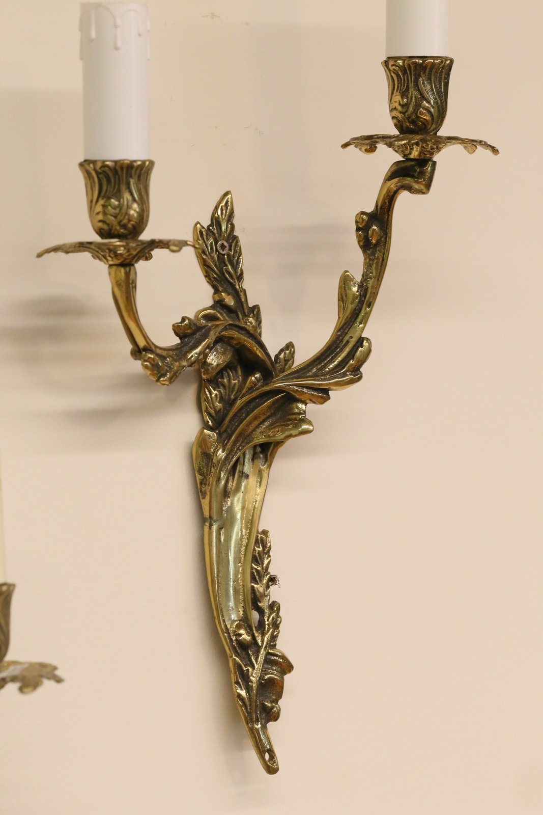 French Louis XV style gilt brass two-arm wall sconce, angled view