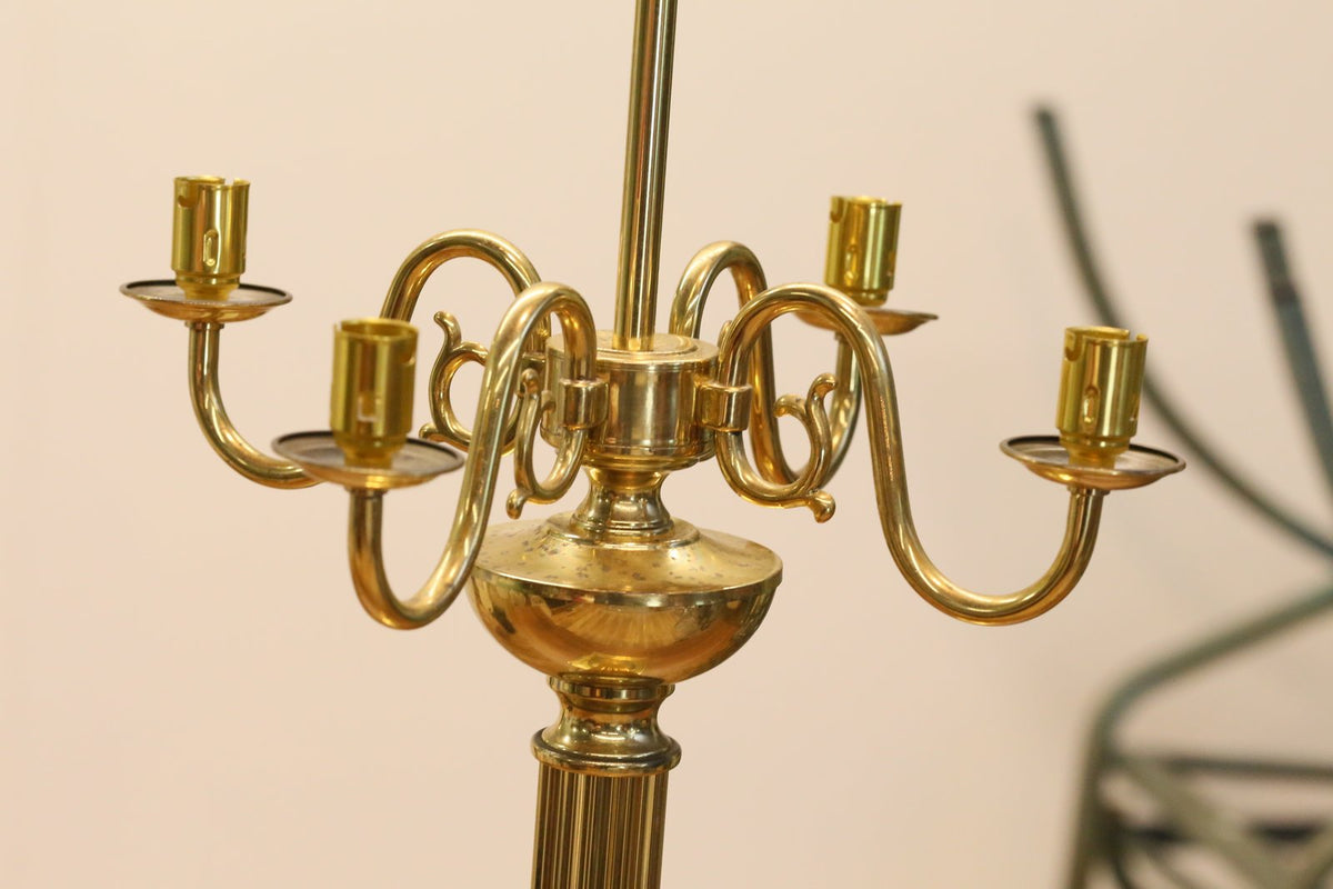 Close-up of brass candelabrum arms, side view