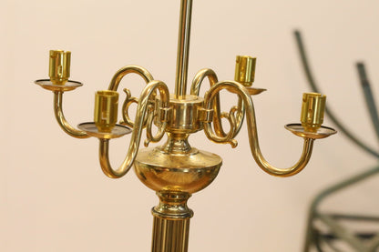 Close-up of brass candelabrum arms, side view
