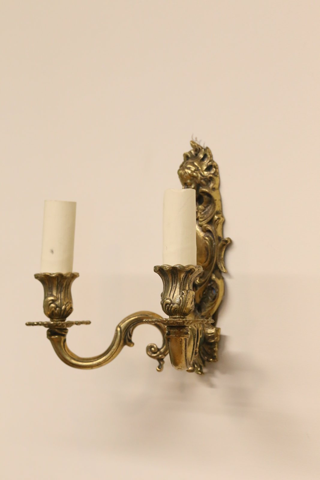 Italian brass cherub wall sconce, side view
