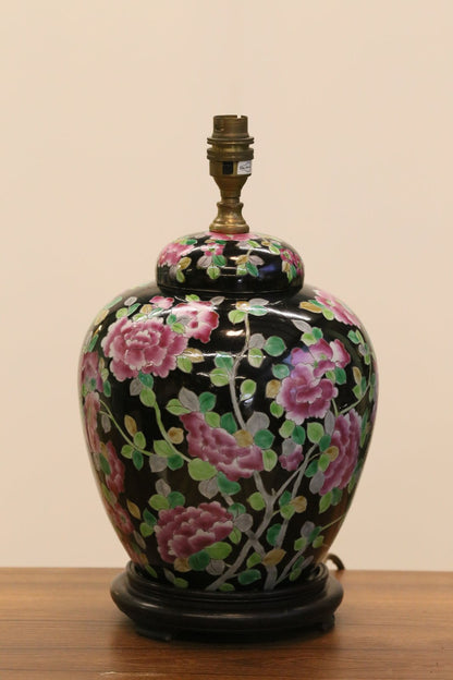 Chinese porcelain floral table lamp base on a sideboard