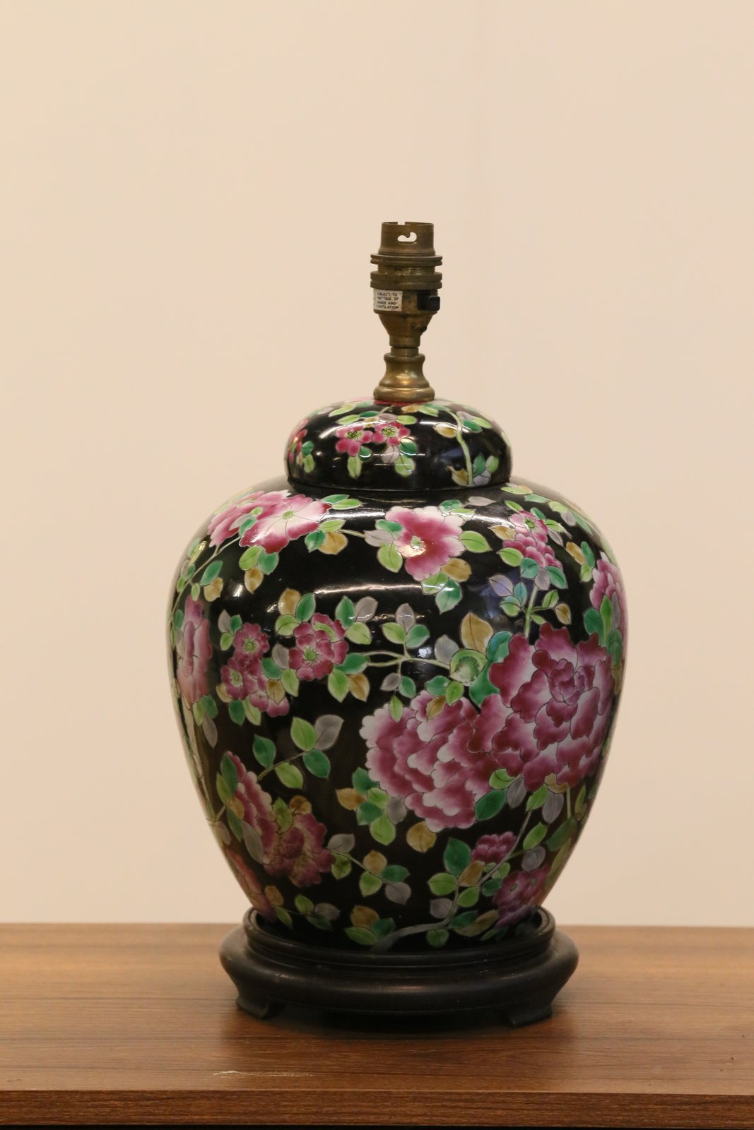 Close-up of floral porcelain body and wooden stand, Chinese lamp