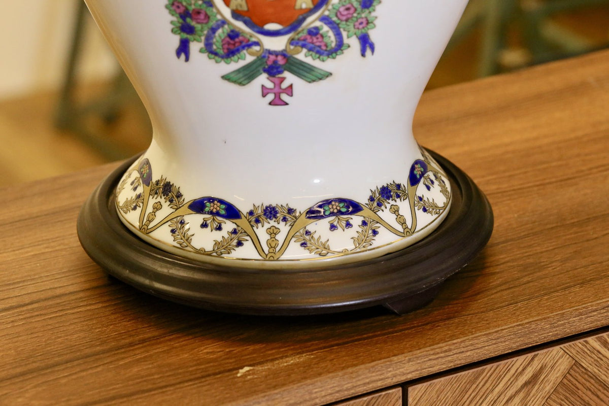 Close-up of the gilt border and turned wooden base, Chinese porcelain lamp
