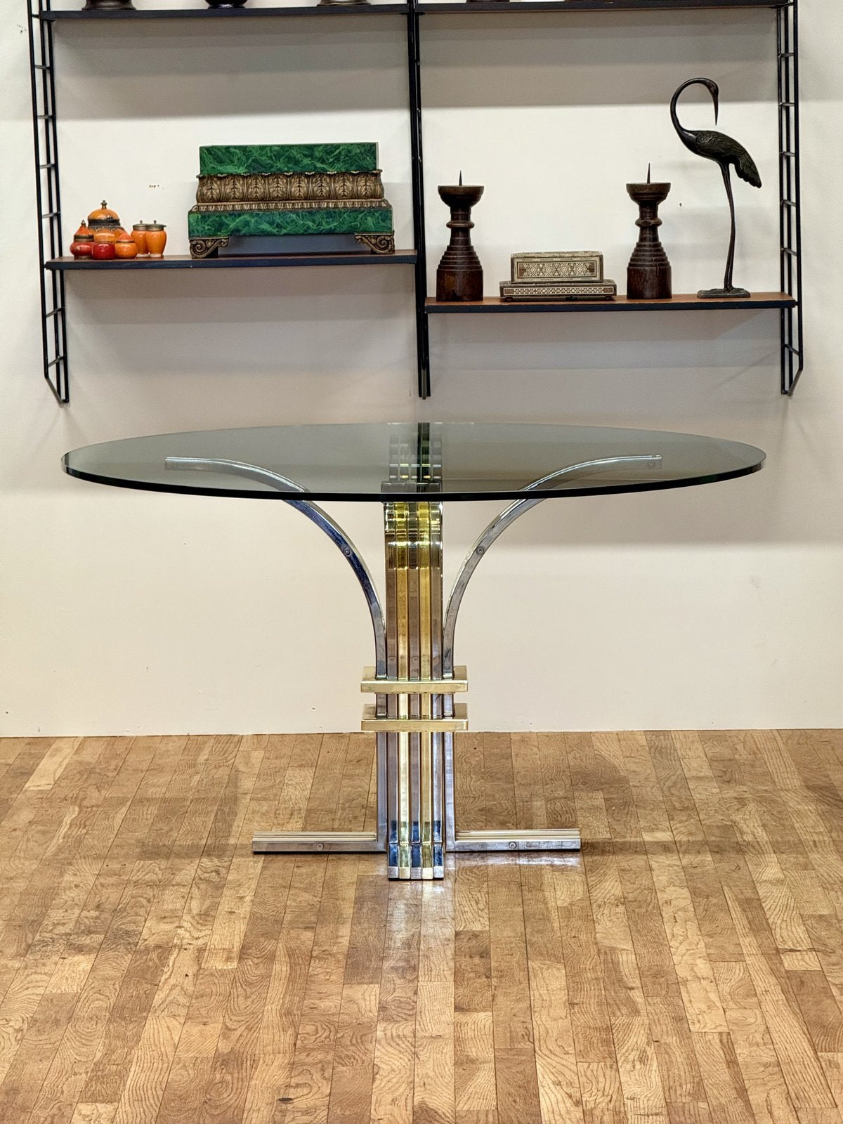 Renato Zevi chrome and brass glass centre table, front view in a room