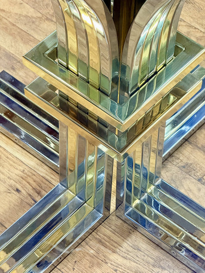 Close-up of chrome and gilt cross base from above