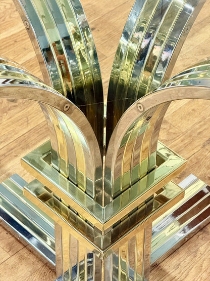 Looking down at the chrome and brass pedestal through the glass