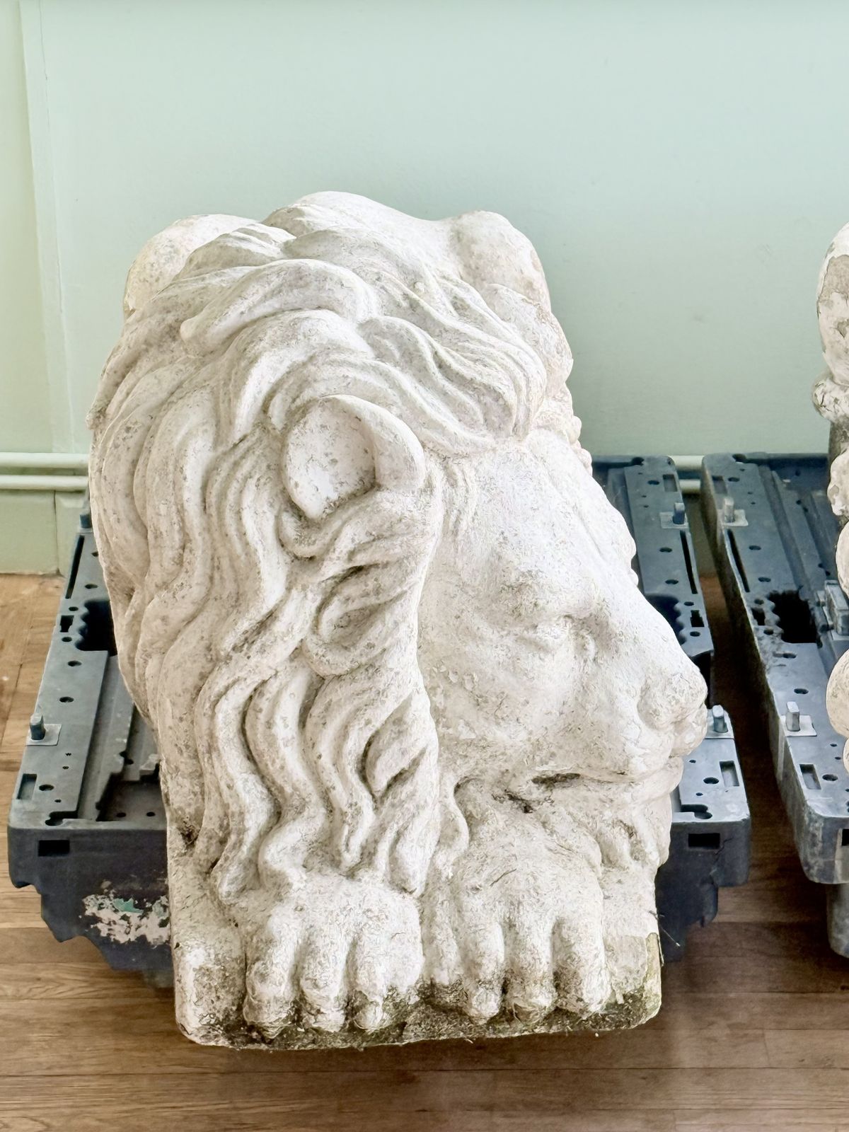Close-up of Cast stone lion after Canova, sleeping head and mane