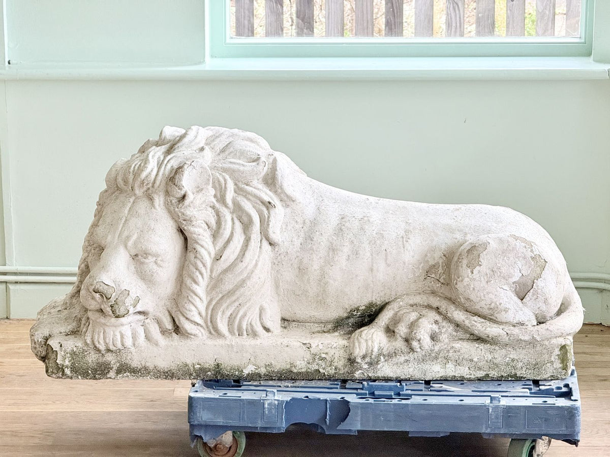 Cast stone lion after Canova, side profile facing left