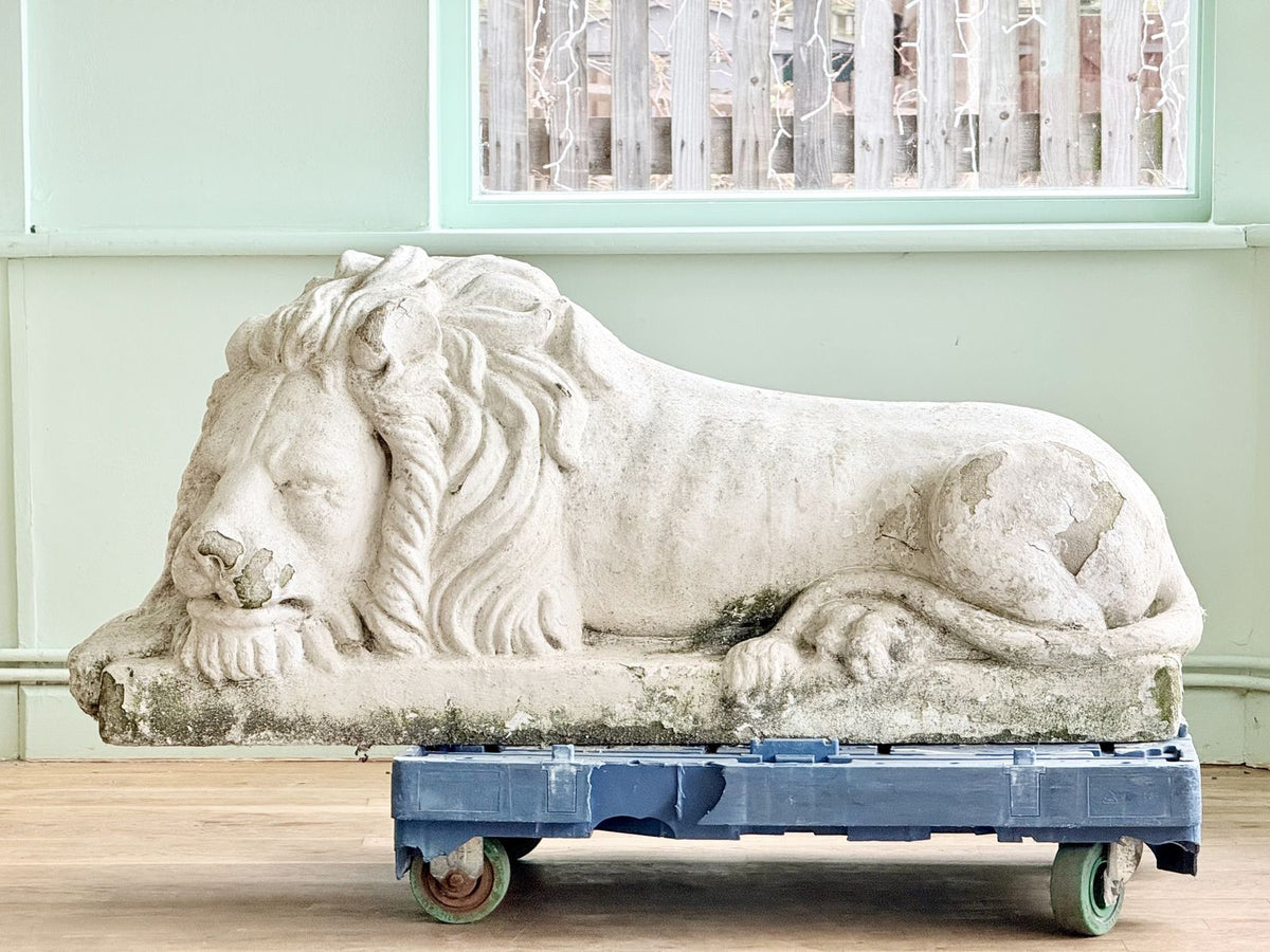 Cast stone lion after Canova, side profile on dolly