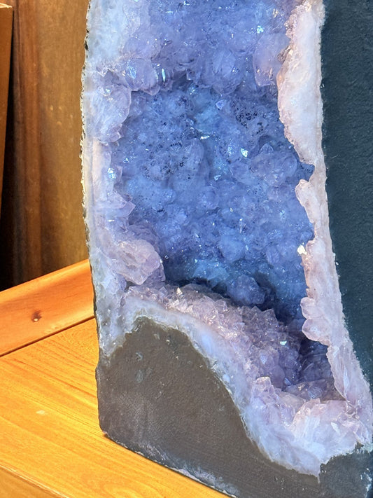 Close-up of violet amethyst crystals inside the cathedral geode