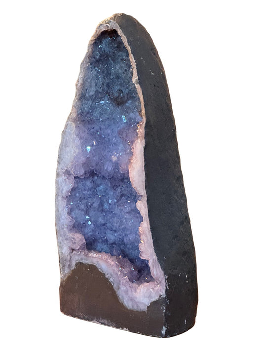 Tall amethyst cathedral geode, Brazil, 20th century, deep violet crystals in a dark basalt shell
