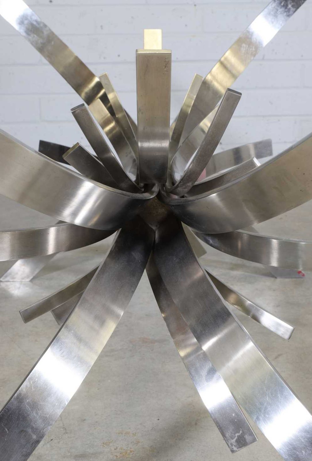 Gerbe table base from above showing radiating stainless steel ribbons