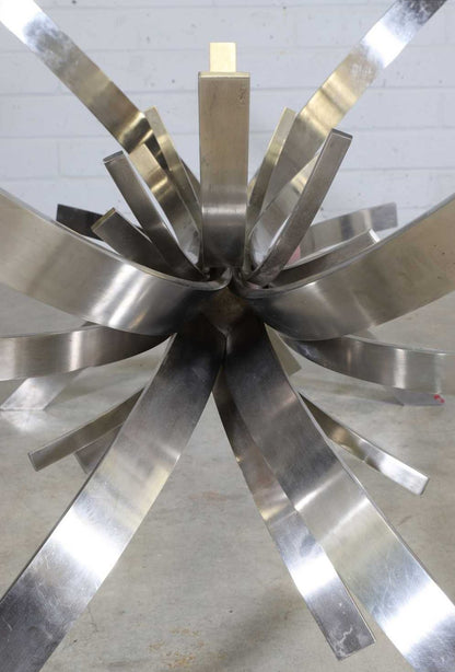 Gerbe table base from above showing radiating stainless steel ribbons