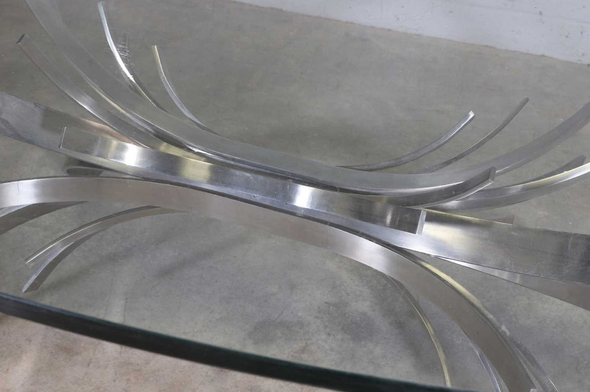 Close-up of stainless steel ribbons seen through the glass top