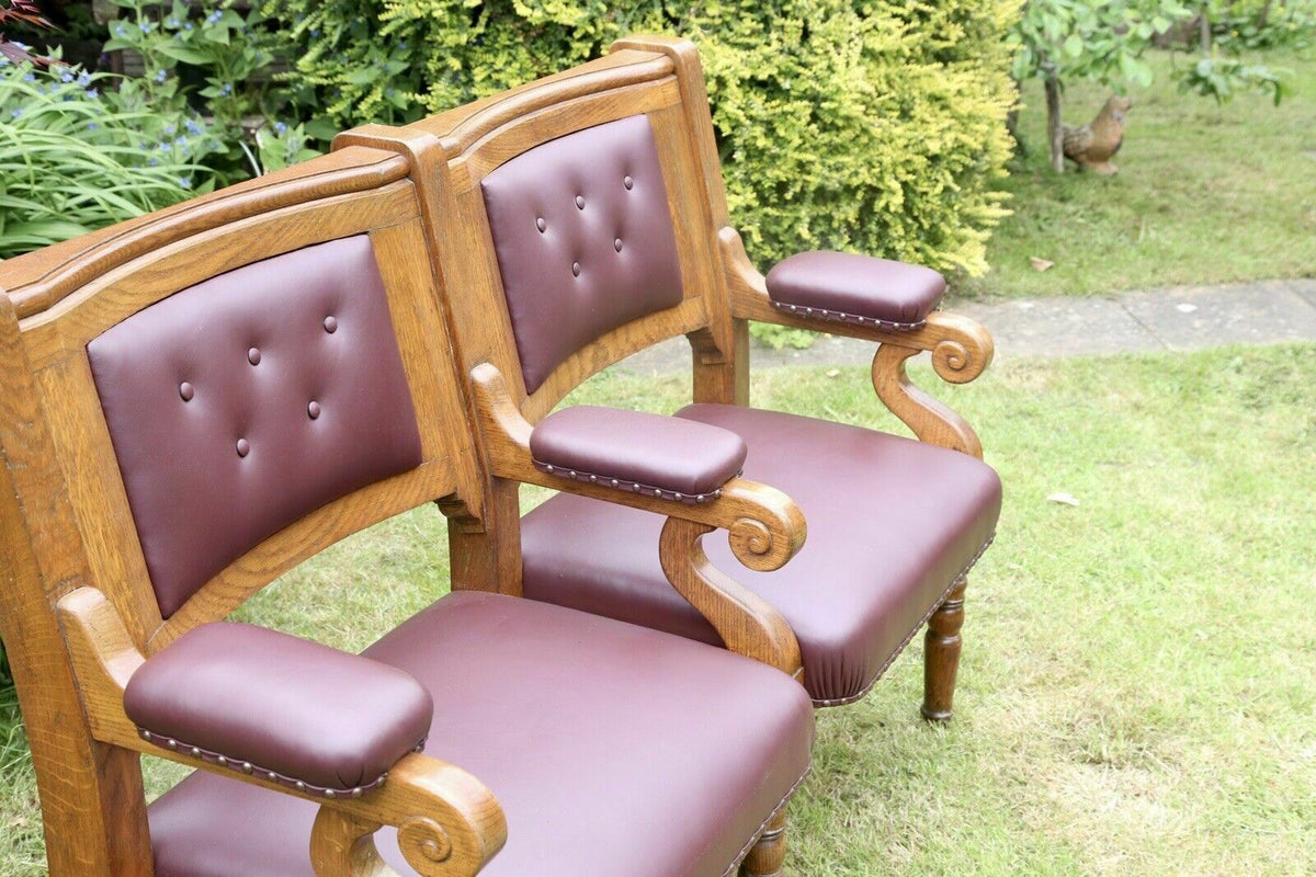 Islington Town Hall oak and burgundy leather bench, three-quarter view from the left