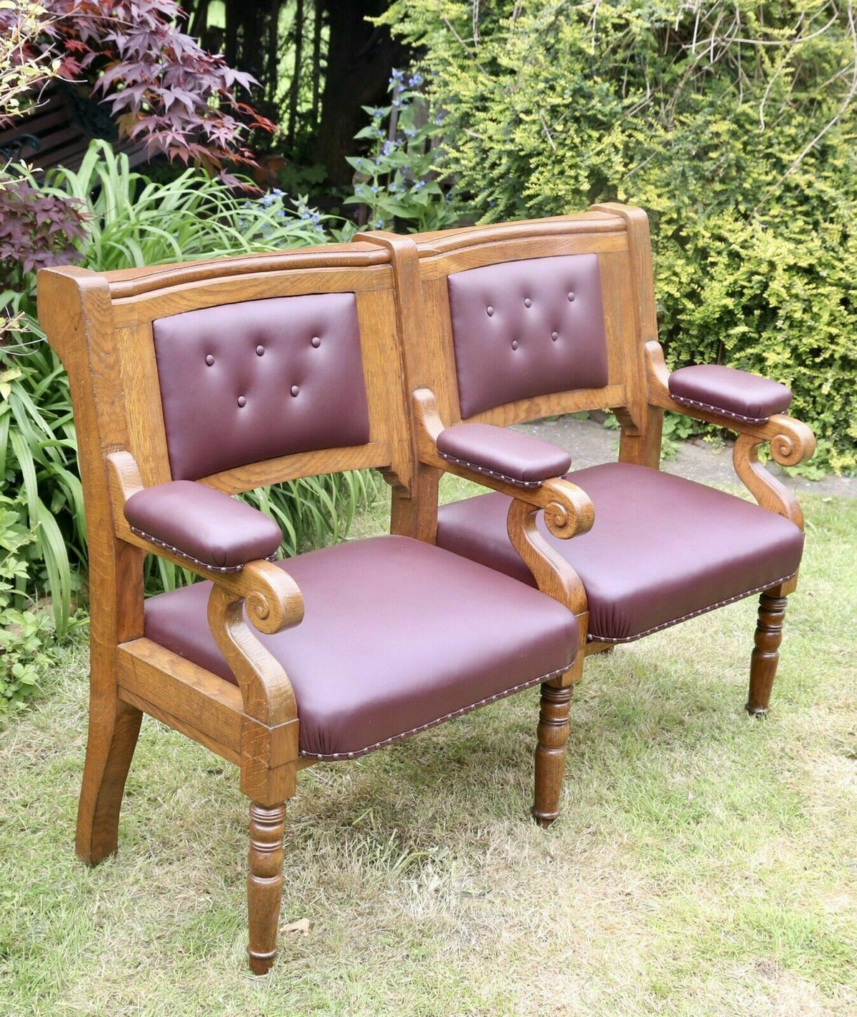Islington Town Hall Victorian solid oak two seater bench with burgundy button leather back, brass studs and scroll arms