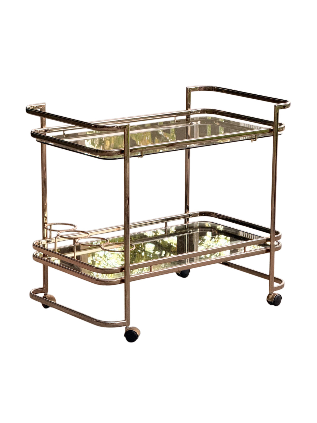 Gilt brass drinks trolley from the front showing the smoked glass top tray, mirror lower tray and bottle holder