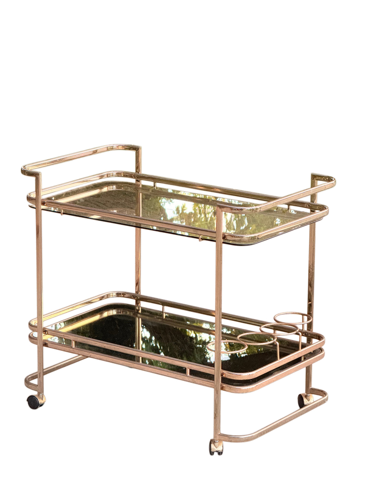 Side view of the 1970s Italian gilt brass trolley on castors
