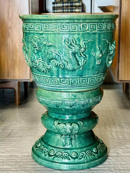 Close-up of relief dragon and Greek key band on the green glazed bowl