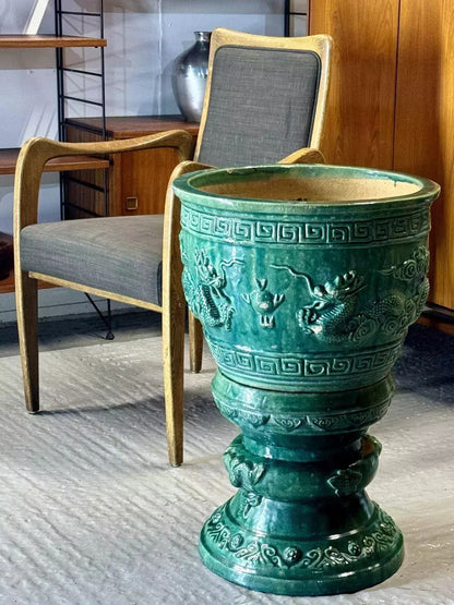 Chinese green dragon glazed jardinière on pedestal, three-quarter view