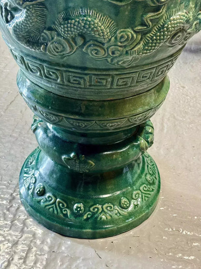 Close-up of the green glazed pedestal stand with relief decoration