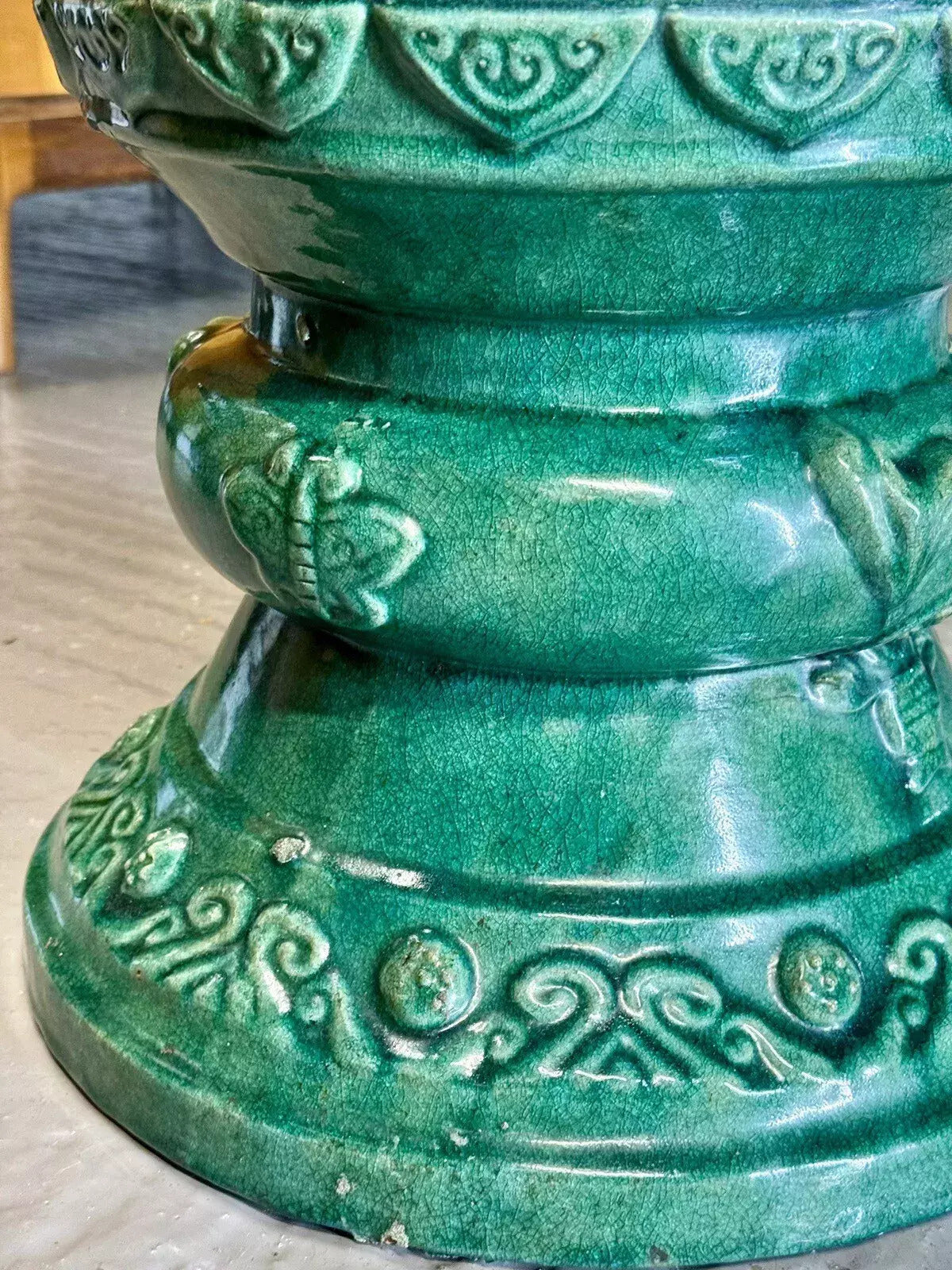 Close-up of pedestal foot with scroll relief, Chinese jardinière