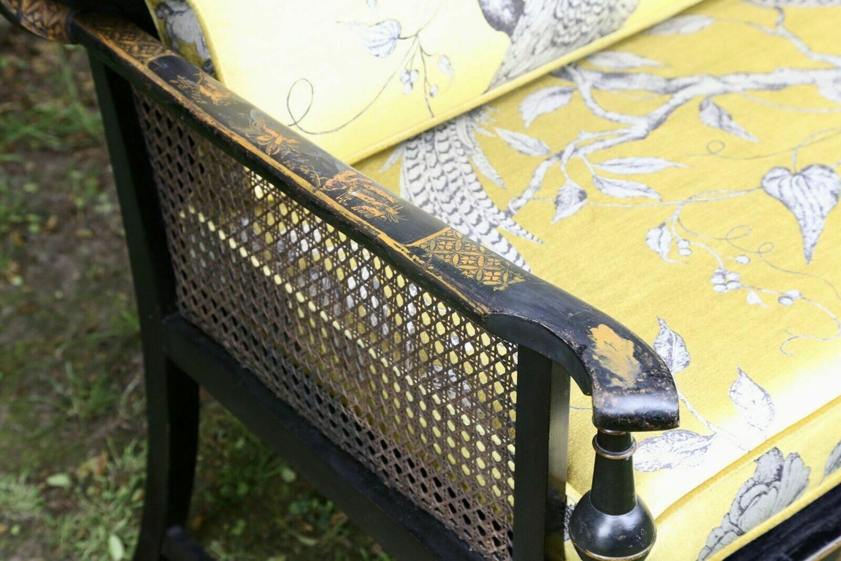 Close-up of caned side and black lacquered arm, chinoiserie sofa
