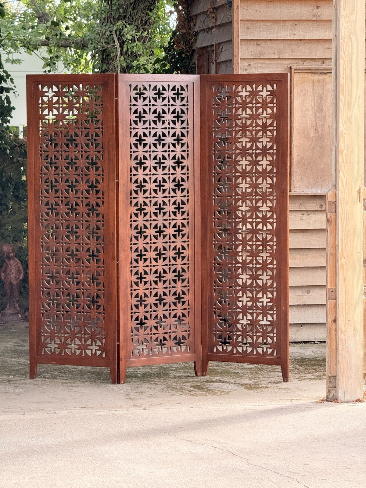Mid-century solid teak three-panel pierced screen, zigzag folded outdoors