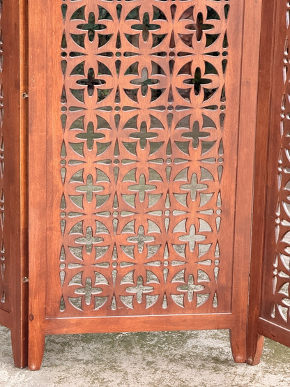 Close-up of lower pierced panel and feet, teak screen