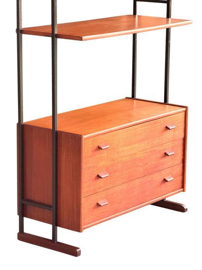 Mid-century teak chest of drawers and bottom shelf on black metal uprights, three-quarter view