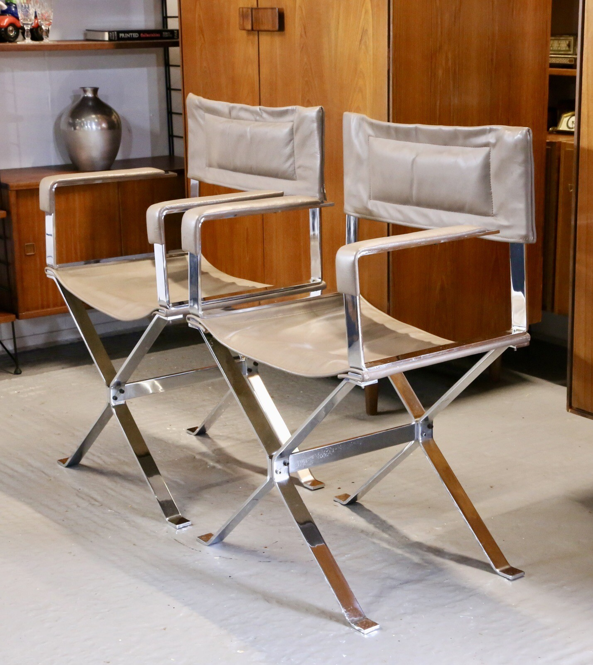 Pair of Alessandro Albrizzi chrome and leather director's armchairs with X-frame bases and taupe leather seats and backs