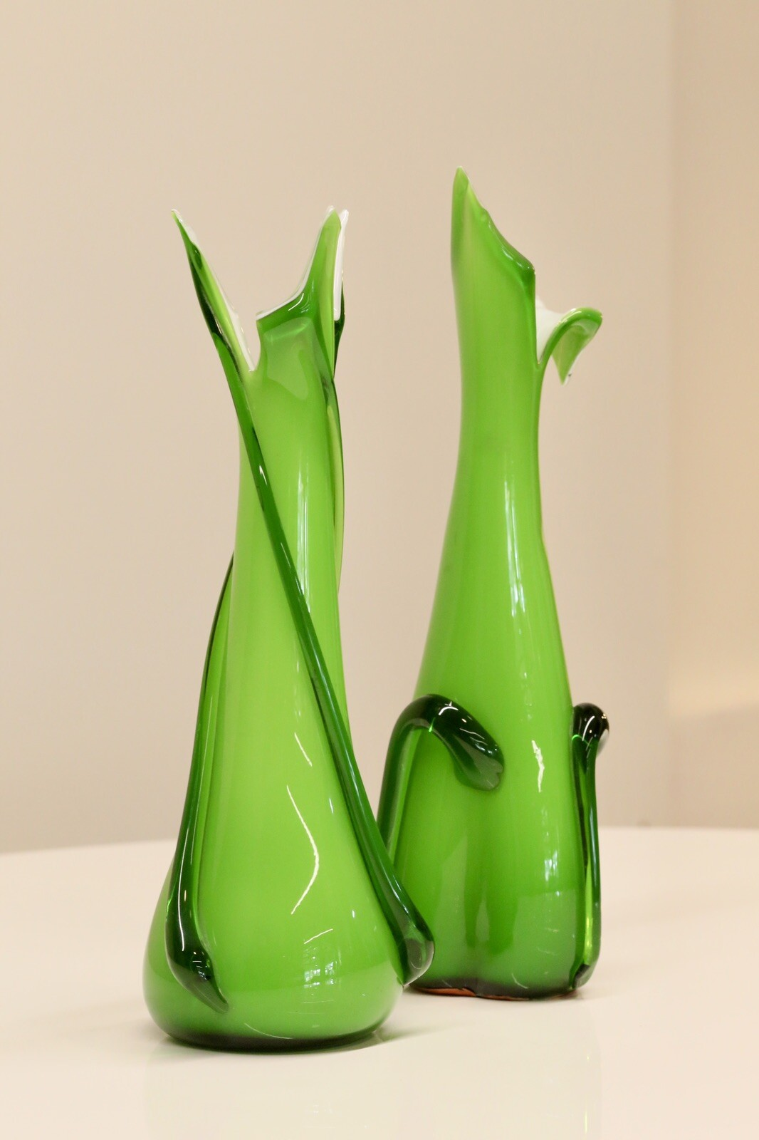Pair of green Empoli art glass vases, angled view