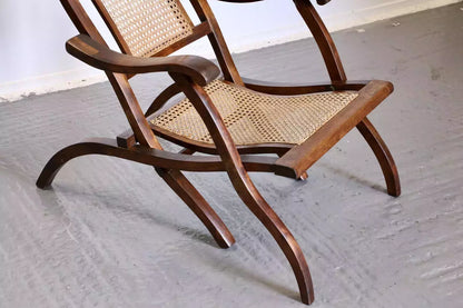Victorian walnut and cane folding steamer chair, seat and leg detail