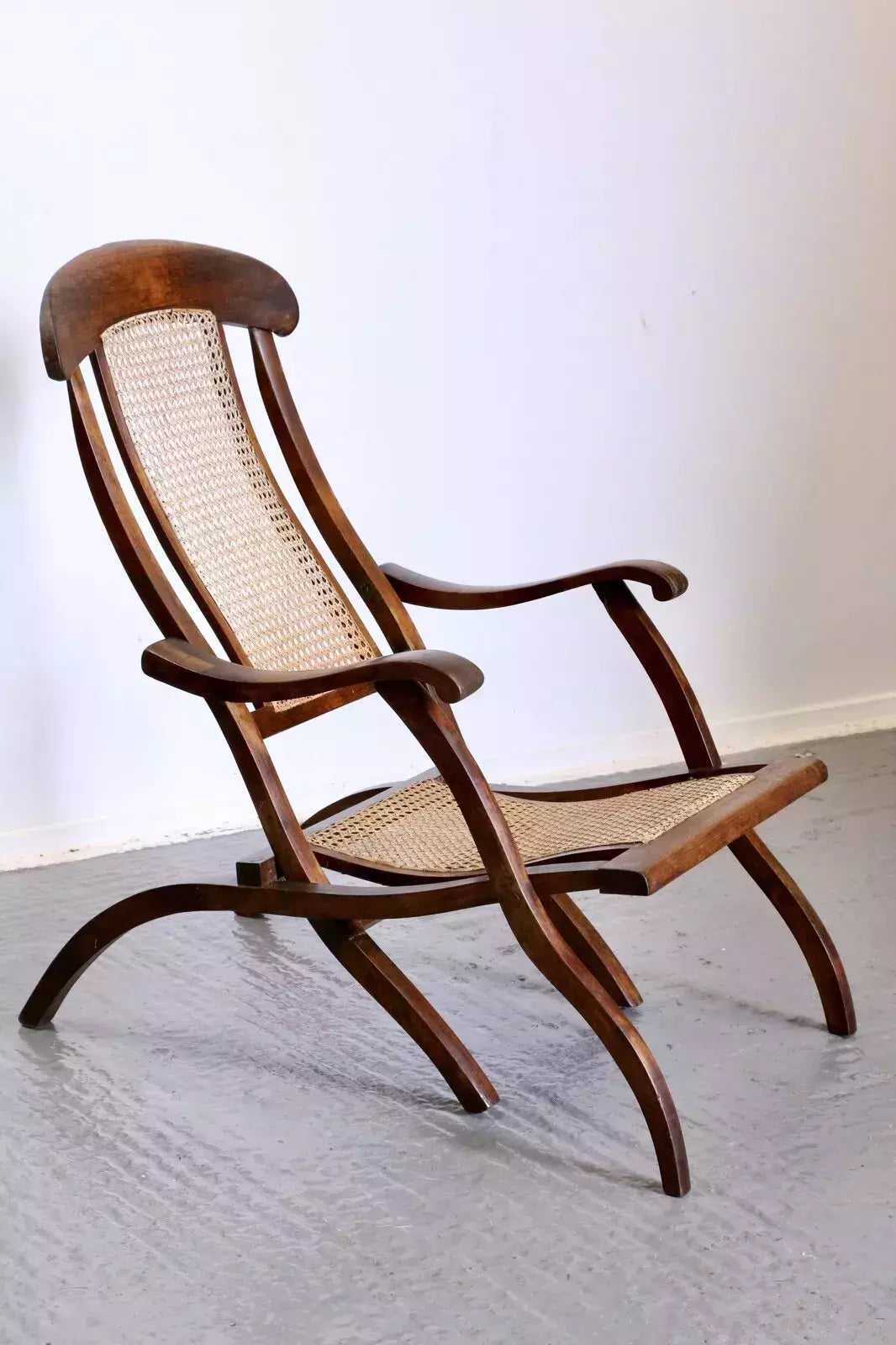 Victorian walnut and cane folding steamer chair, three-quarter view
