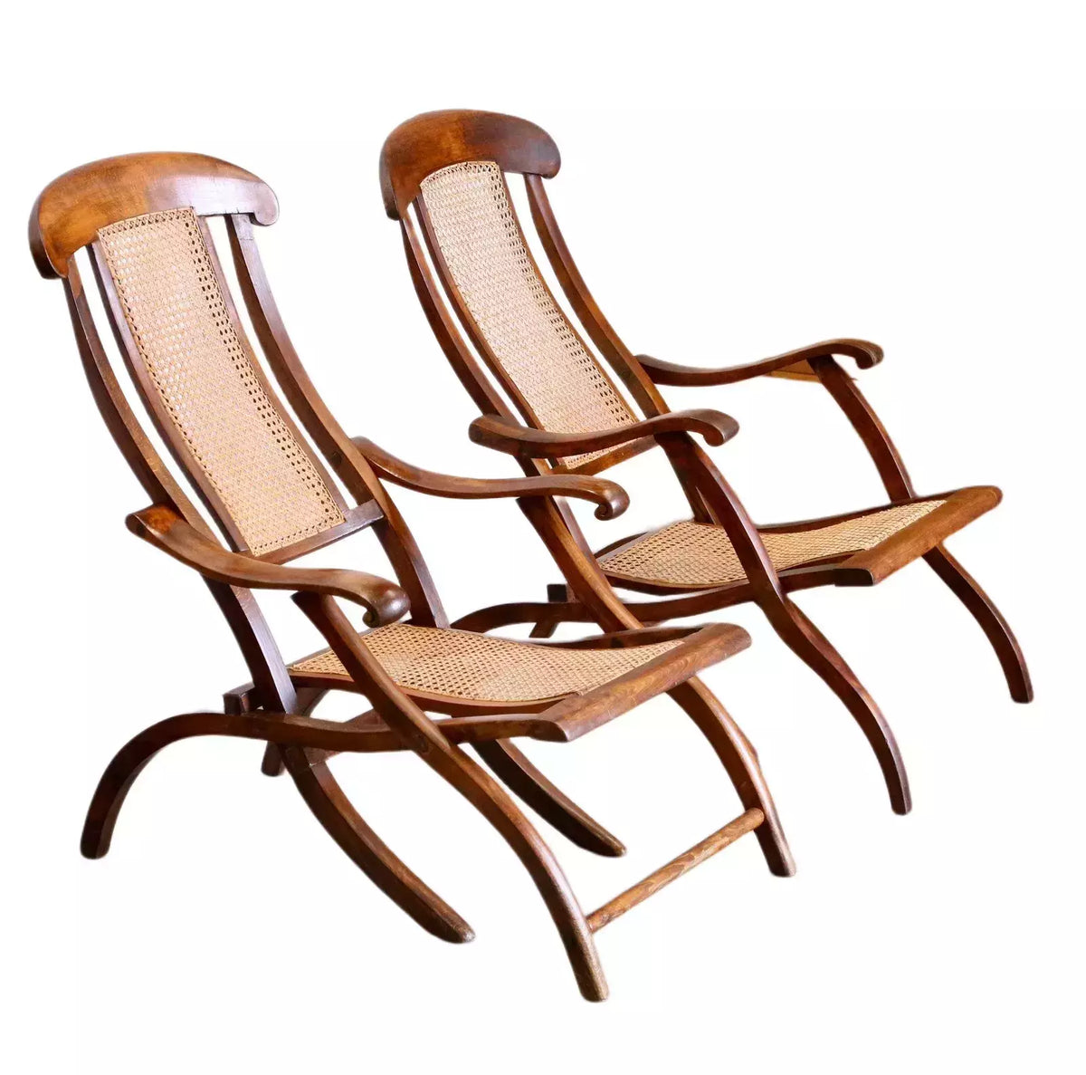 Pair of fine early Victorian walnut and cane folding travel steamer chairs with scrolled arms
