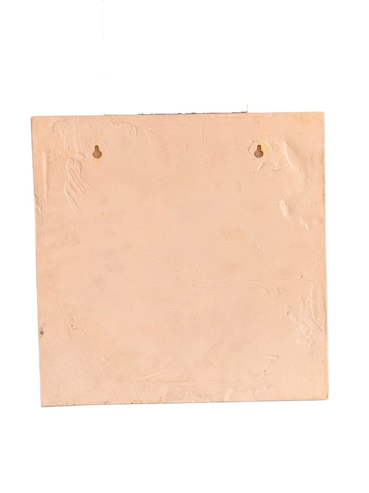 Back of the plaster cherub wall plaque with hanging fixings