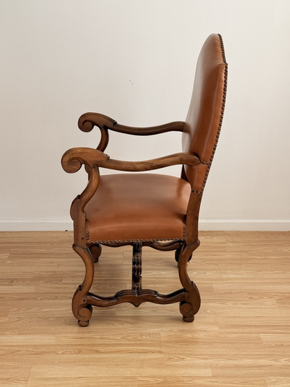 Spanish Baroque Revival carved wood and leather armchair, side profile