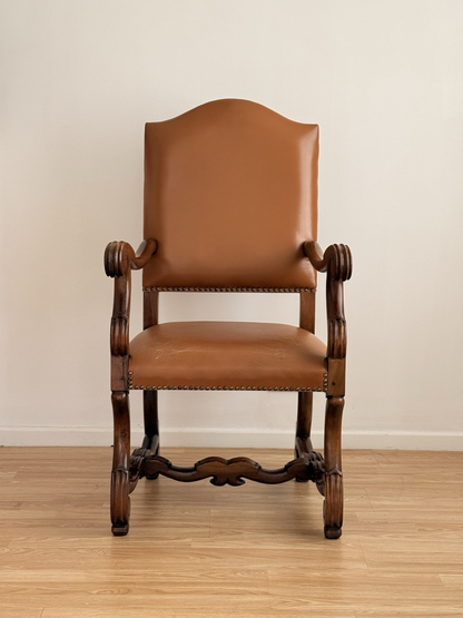 Spanish Baroque Revival carved wood and leather armchair, front view