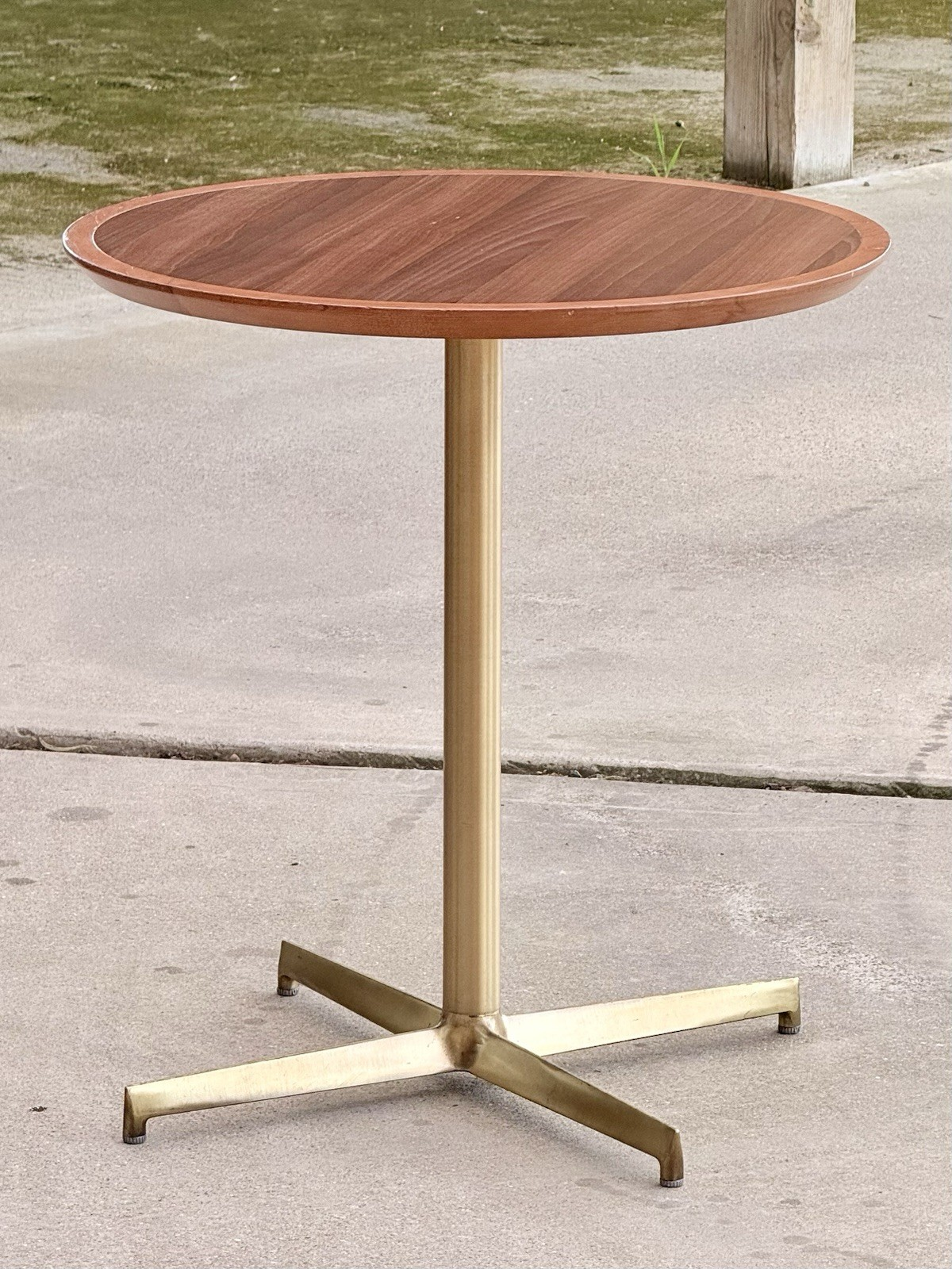 Pedrali mahogany finish side table, side view outdoors
